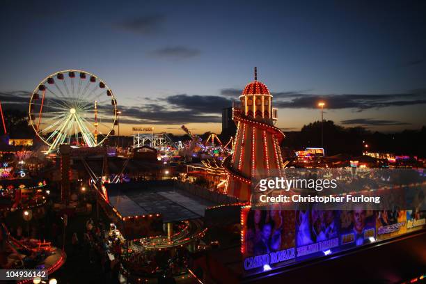 Helter skelter illuminates the sky as revellers enjoy the thrills and fun of the traditional fair ground at the annual Goose Fair on October 6, 2010...