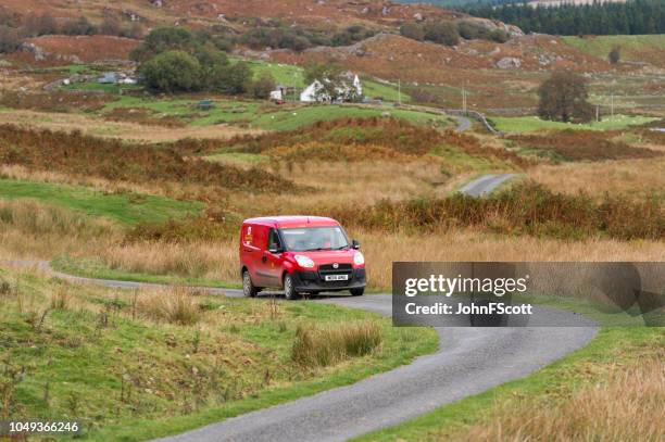 post van on a rural road in dumfries and galloway south west scotland - postal worker stock pictures, royalty-free photos & images
