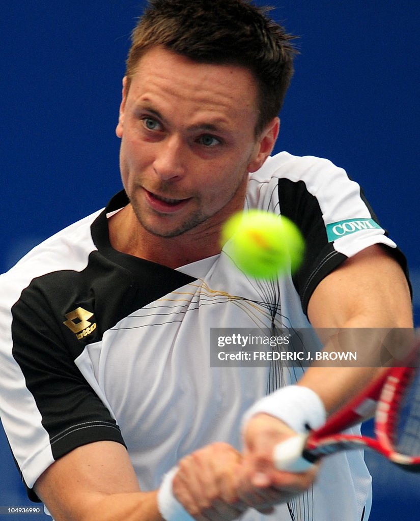 Robin Soderman Robin Soderling of Sweden hits a return against Albert Montanes of ...