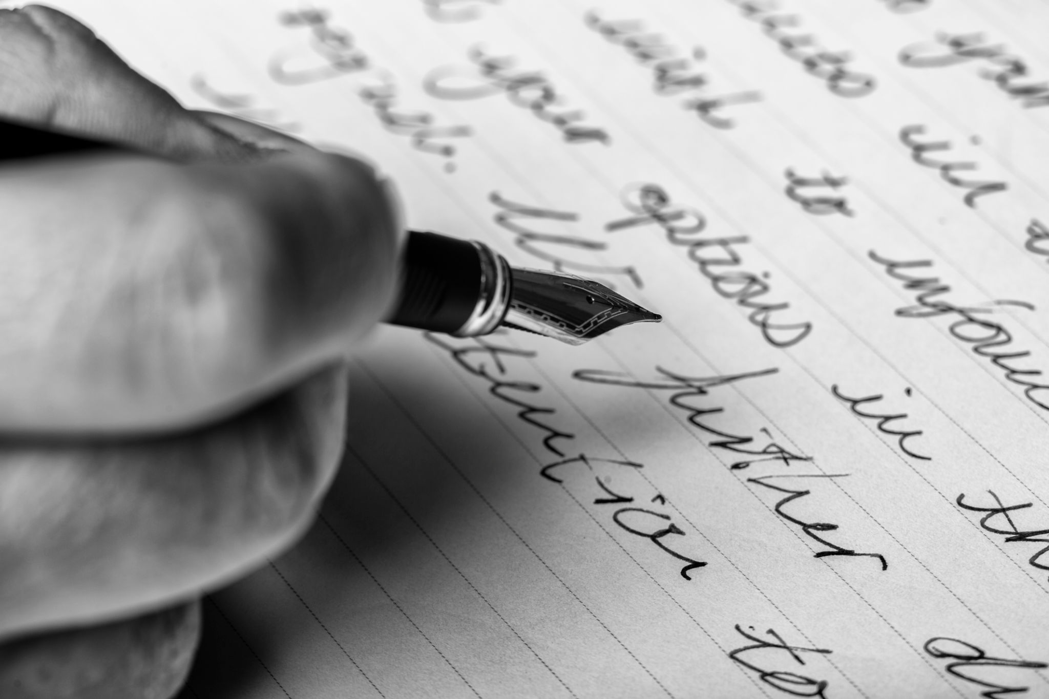 Hand writes words with a fountain pen on paper Hand writes words with a fountain pen on paper