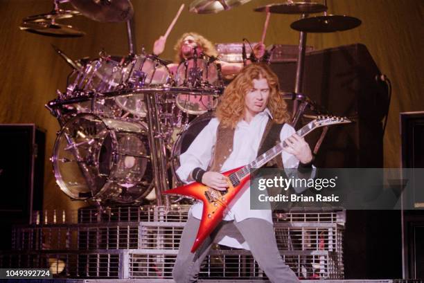 American guitarist and singer Dave Mustaine and drummer Nick Menza perform live on stage with heavy metal group Megadeth at Brixton Academy in London...