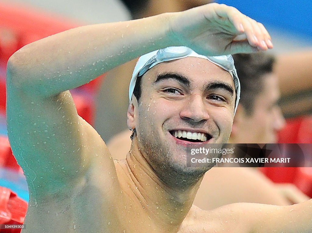 Tongan swimmer Amini Fonua gestures duri