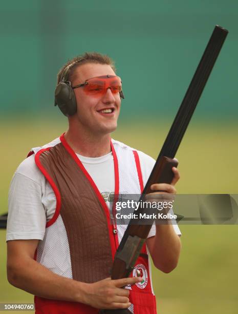 Stevan Walton of England poses celebrates winning the gold medal in the men's double trap at the Dr Karni Singh Shooting Range during day four of the...