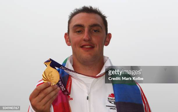 Stevan Walton of England poses with his gold medal won in the men's double trap at the Dr Karni Singh Shooting Range during day four of the Delhi...