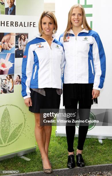 Tania Cagnotto and Carolina Kostner attend the Herbalife Press Conference held at Four Seasons Hotel on October 7, 2010 in Milan, Italy.