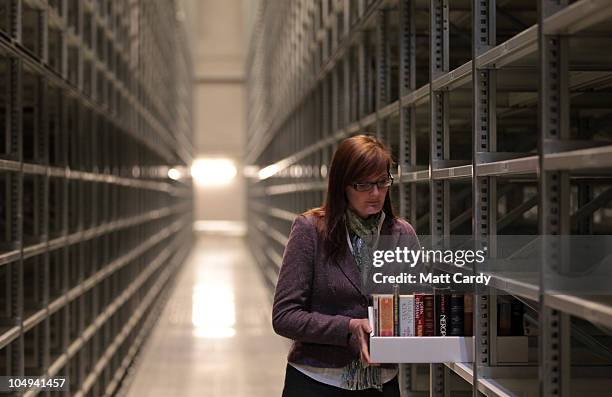 Alison Prince, from the University of Oxford's Bodleian Libraries carries a box of books in the new Book Storage Facility on October 7, 2010 in...