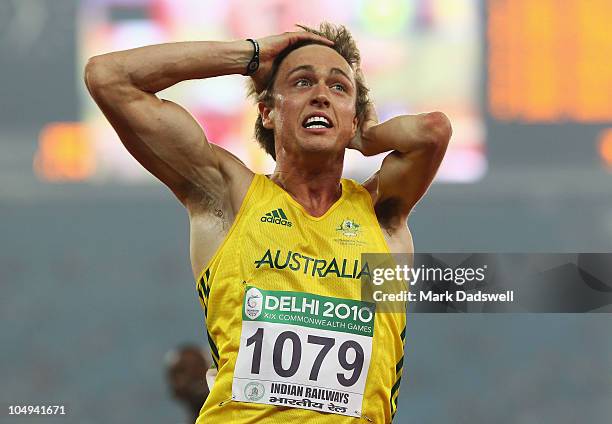 Simon Patmore of Australia celebrates after winning gold in the men's T46 100 metres final during day four of the Delhi 2010 Commonwealth Games at...