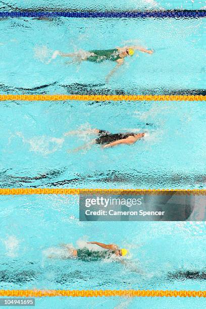 Sophie Edington of Australia, Gemma Spofforth of England and Grace Loh of Australia compete in the Women's 50m Backstroke Semifinal 2 at the Dr. S.P....