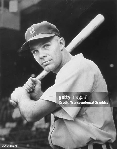 Portrait of American baseball player Harvey Kuenn , of the Detroit Tigers, as he poses with a bat in Briggs Stadium, Detroit, Michigan, 1952. The...