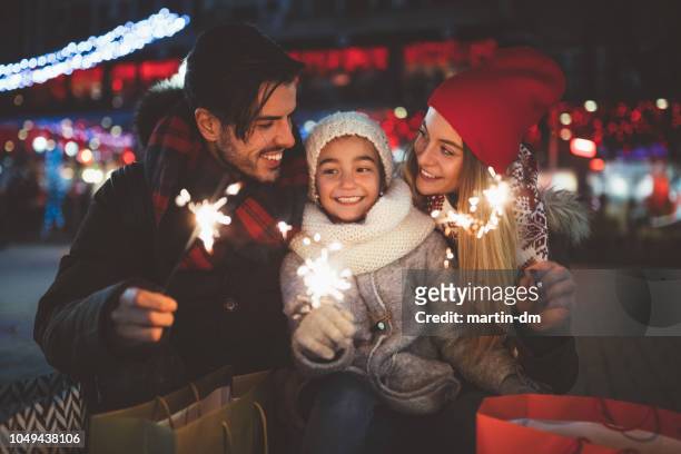 happy family celebrating christmas - family new year's eve stock pictures, royalty-free photos & images