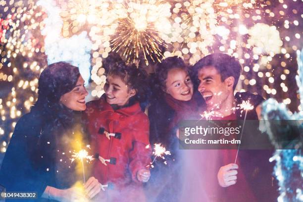 happy family celebrating christmas - happy new year 2018 stock pictures, royalty-free photos & images