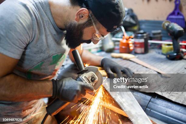 worker grinding metal - metal sanding stock pictures, royalty-free photos & images