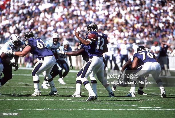 Quarterback Tony Banks of the Baltimore Ravens gets a bad hike from the Center during a NFL game against the Tennessee Titans at PSINet Stadium on...