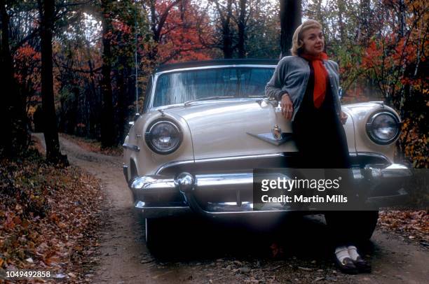 American comedienne, actress, singer and businesswoman Edie Adams poses for a portrait in front of her 1952 Lincoln Capri circa October, 1952 in...