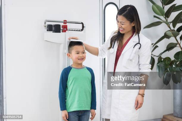 young boy at the doctor's office - altitude sickness stock pictures, royalty-free photos & images