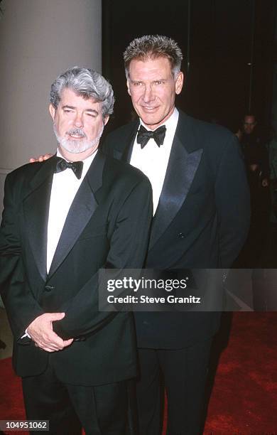 George Lucas & Harrison Ford during American Film Institute Honors Harrison Ford with 2000 Lifetime Achievement Award at Beverly Hilton Hotel in...