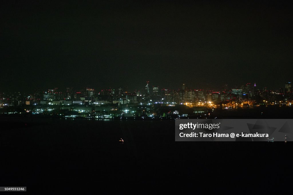 Tokyo Bay and Tokyo cityscape night time aerial view from airplane