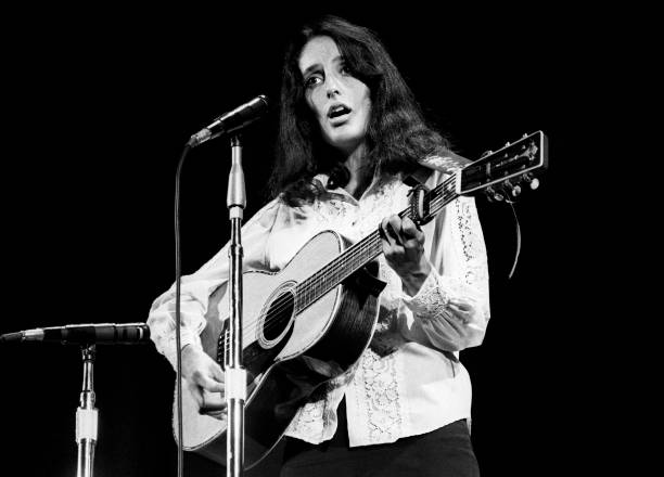 Folksinger Joan Baez performs at Ravinia Park in August 1968 in Highland Park, Illinois.