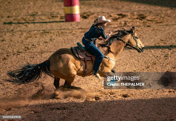 young cowgirl barrel racing rodeo - barrel race stock pictures, royalty-free photos & images