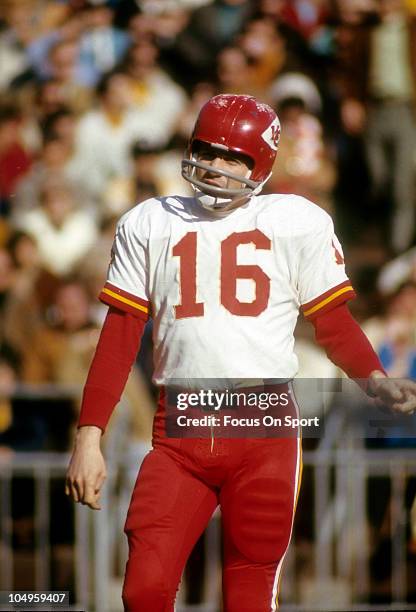 Quarterback Len Dawson of the Kansas City Chiefs standing on the field against the Oakland Raiders during an NFL football game circa 1970 at the...