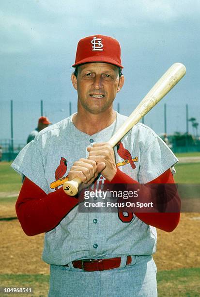 Outfielder/First Baseman Stan Musial of the St. Louis Cardinals holds his bat on his shoulder and poses for this photo prior to the start of a Major...