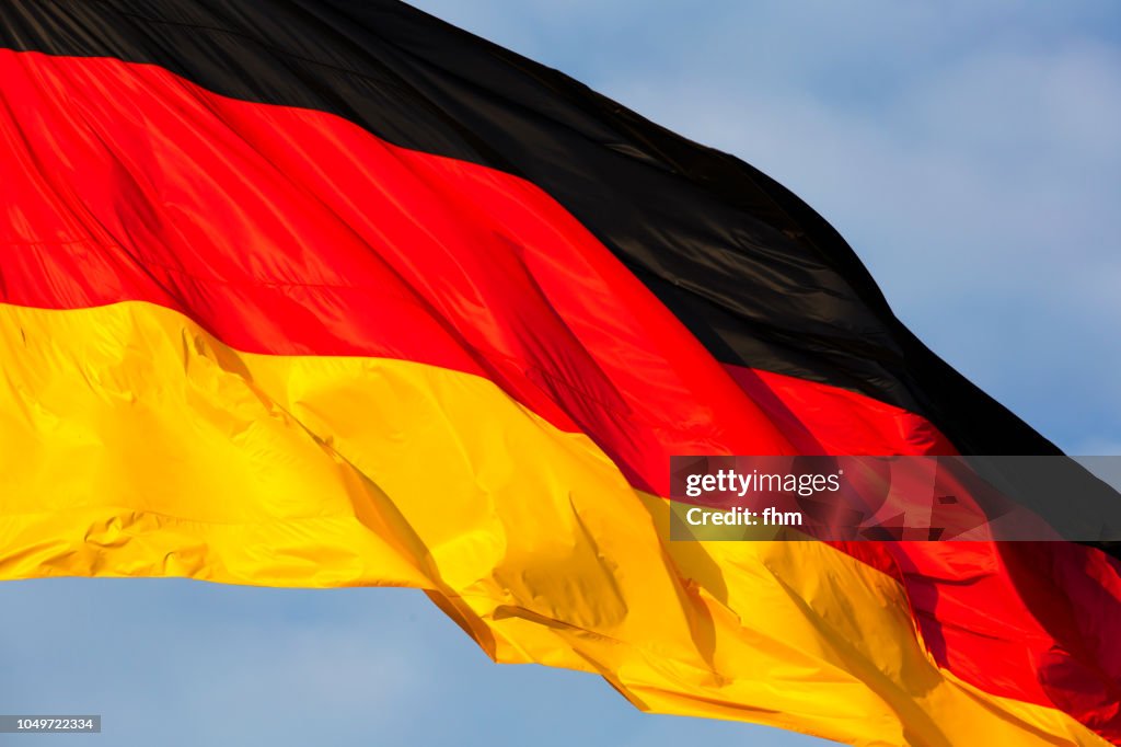 German flag with dramatic sky (Berlin, Germany)