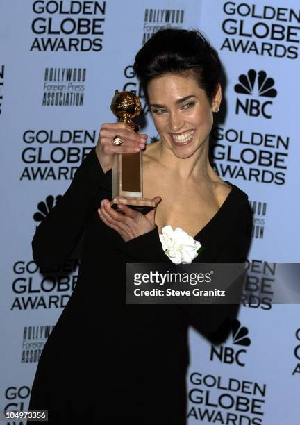 Jennifer Connelly holds her award for Best Supporting Actress in a Motion Picture for her role in "A Beautiful Mind" at the 59th Annual Golden Globe...