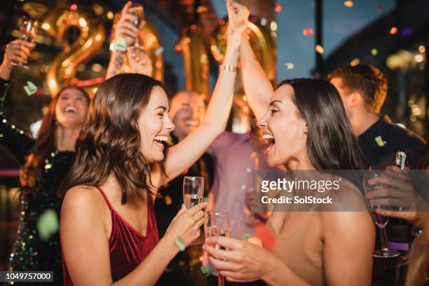 celebrating the new years eve count down - new years eve 2019 stock pictures, royalty-free photos & images