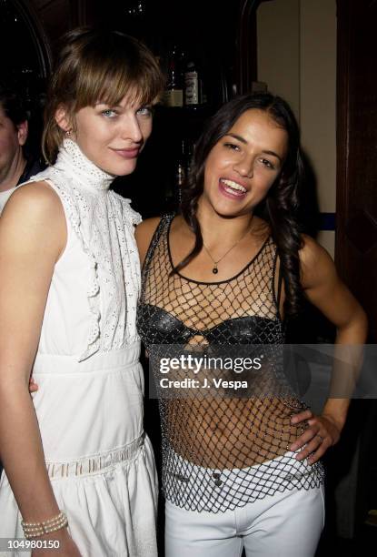 Milla Jovovich & Michelle Rodriguez during "Resident Evil" Premiere After Party at the GQ Lounge at GQ Lounge in Los Angeles, California, United...