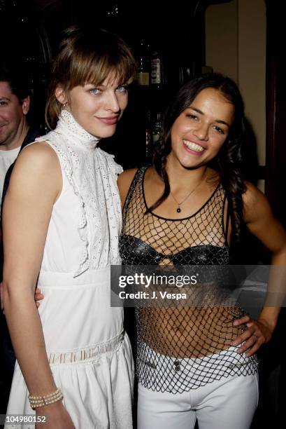 Milla Jovovich & Michelle Rodriguez during "Resident Evil" Premiere After Party at the GQ Lounge at GQ Lounge in Los Angeles, California, United...