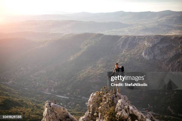 young man standing at edge in peak district - peak district national park stock pictures, royalty-free photos & images