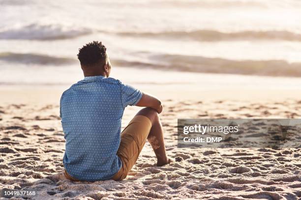 the ultimate place to relax and reconnect - man sitting alone stock pictures, royalty-free photos & images