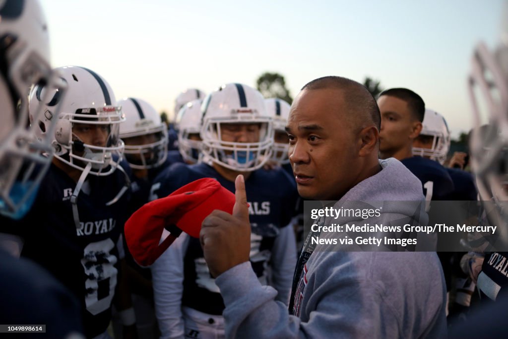 Overfelt High School football head coach Carlo Maningo talks to this