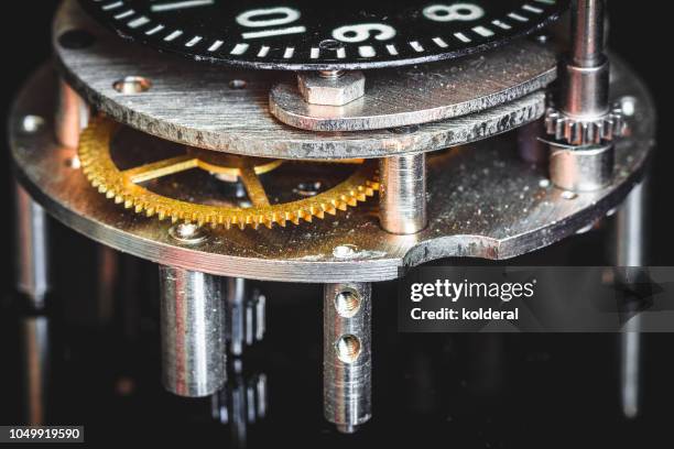 close-up of watch mechanism - uhrwerk stock-fotos und bilder