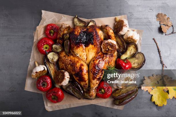 butterflied roast chicken with  seasonal autumn vegetables - chicken roasting oven stock pictures, royalty-free photos & images