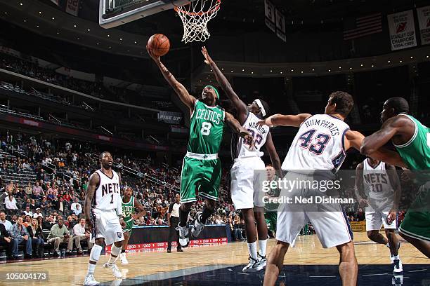 Marquis Daniels of the New Jersey Nets shoots against Anthony Morrow of the Boston Celtics on October 7, 2010 at the Prudential Center in Newark, New...