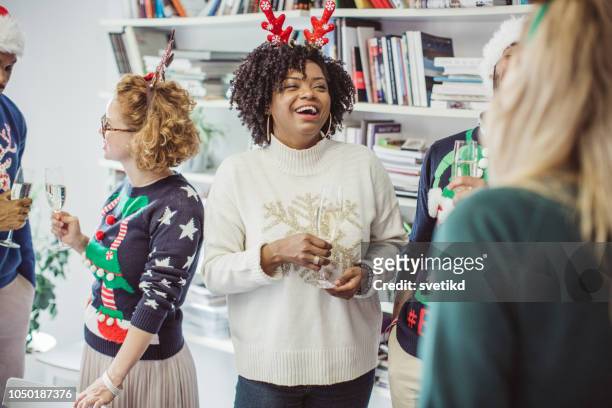 ugly sweater day at work - christmas jumper stock pictures, royalty-free photos & images