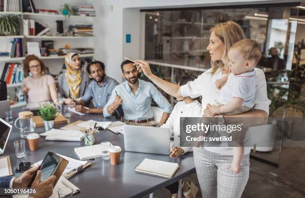 office presentation of single mother - indian woman with baby stock pictures, royalty-free photos & images