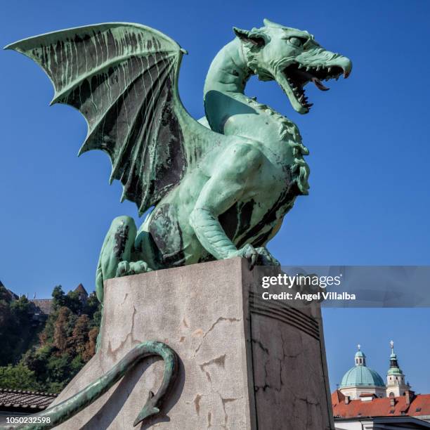 ljubljana. one of the dragons of the bridge of the dragons - ljubljana stockfoto's en -beelden