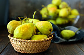 Fresh garden pears on dark wooden table