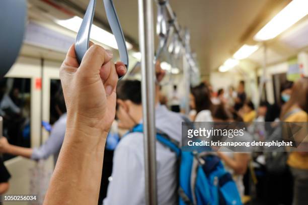 handle loop in sky train - bts skytrain stock pictures, royalty-free photos & images