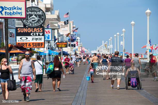 walking on boardwalk in ocean city - ocean city maryland stock pictures, royalty-free photos & images
