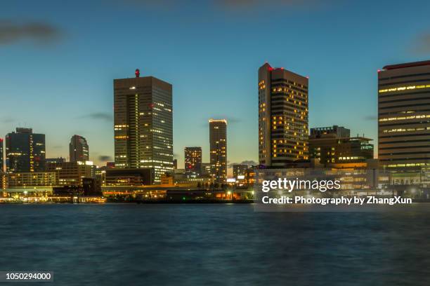 tokyo skyline waterfront over tokyo bay with skyscrapers office buildings at twilight, tokyo, japan. - kachidoki tokyo stock pictures, royalty-free photos & images