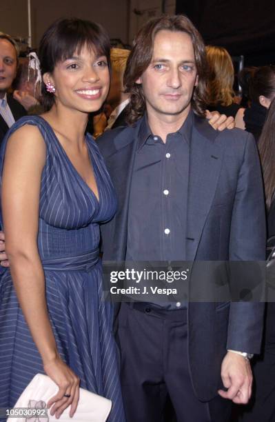 Rosario Dawson and Luca Orlandi during Mercedes Benz Fashion Week Fall 2003 Collections - Luca Luca - Front Row at Bryant Park in New York City, New...