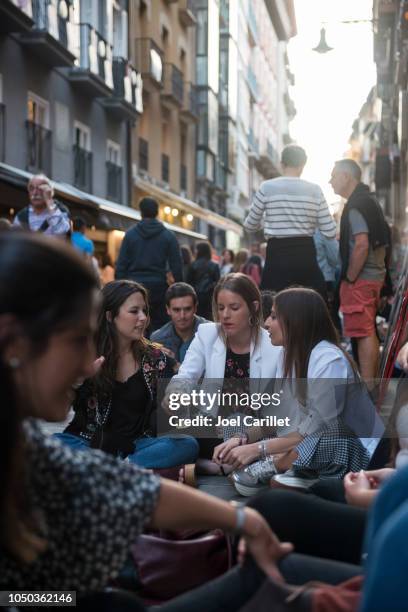 vibrant street life outside bar in pamplona, spain - navarra stock pictures, royalty-free photos & images