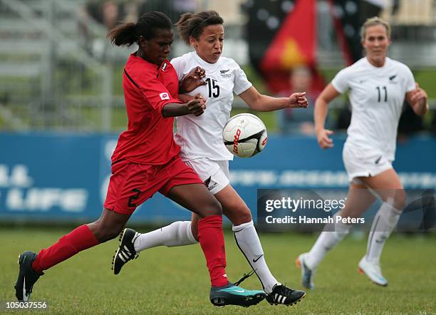 Esther Kurabi of Papua New Guinea competes with Sarah Gregorius of New Zealand during the OFC Women's Nations Cup Final match between New Zealand and...