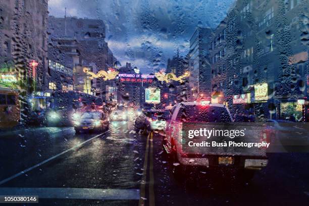 view from dashboard with rain drops of traffic jam in the streets of manhattan, new york city - trucks on queue stock pictures, royalty-free photos & images