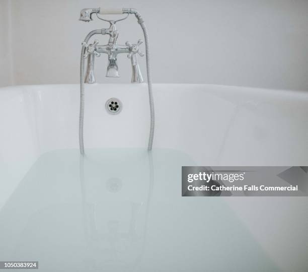 roll top bath - overflowing bathtub stock pictures, royalty-free photos & images