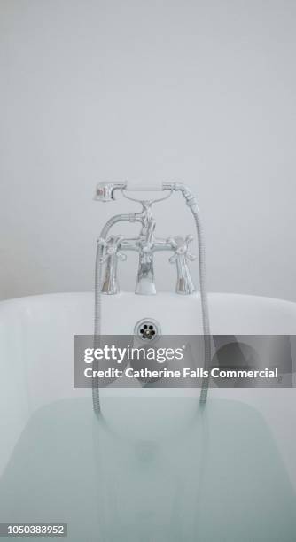 roll top bath - overflowing bathtub stock pictures, royalty-free photos & images