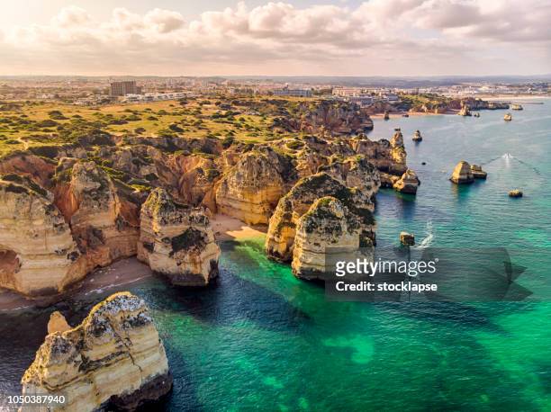 ponta da piedade cliffs aerial view in algarve, portugal - portugal stock pictures, royalty-free photos & images